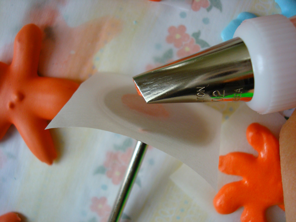 Piping Royal Icing Flowers into Wax Paper 