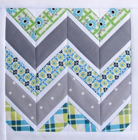 Blue and Grey-Toned Quilt with Chevron Pattern