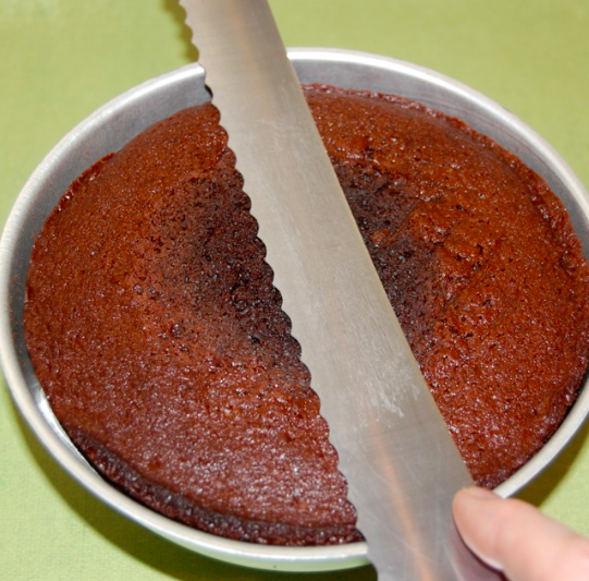 Baked Chocolate Cake in a Pan and Serrated Knife