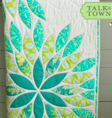 sea glass quilt with brilliant floral pattern
