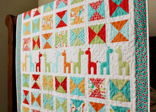 colorful giraffe patterned quilt