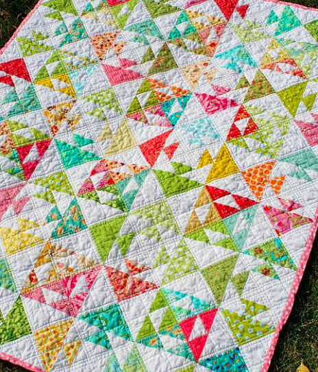 pieced fish quilt featuring flying geese design