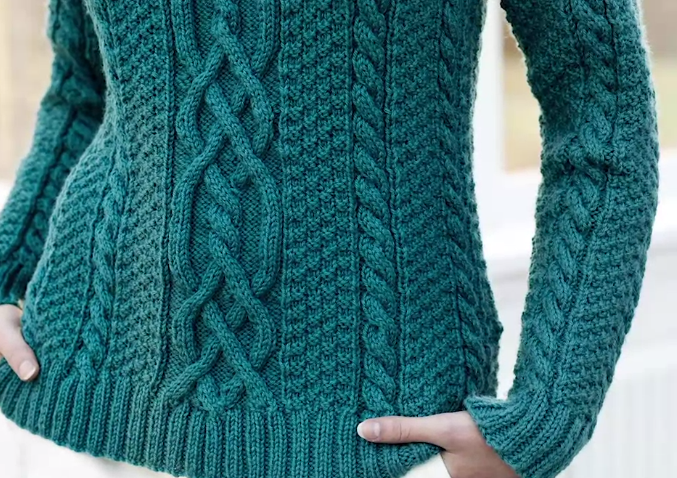 Woman Modeling Green Cable Sweater