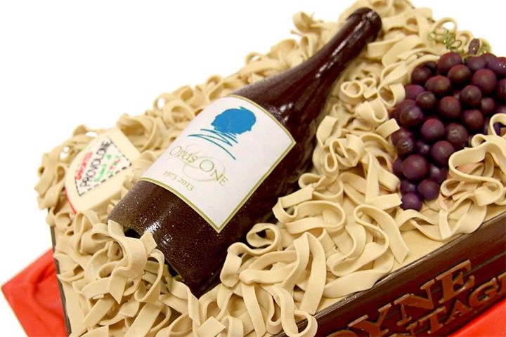 Cake in Shape of Wine Bottle with Cheese and Grapes