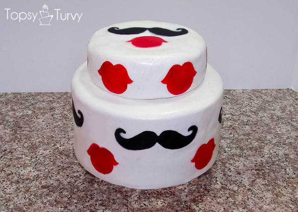 White Tiered Cake with Painted Lips and Mustaches