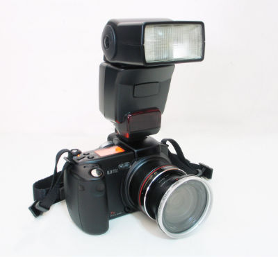 Camera with Speedlight Attached On Top