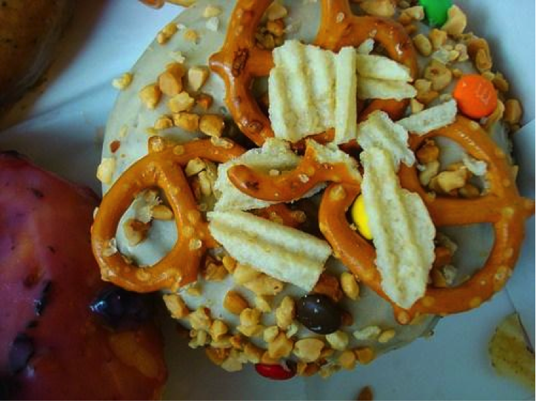 Doughnut Covered in Peanuts, Pretzels and Potato Chips