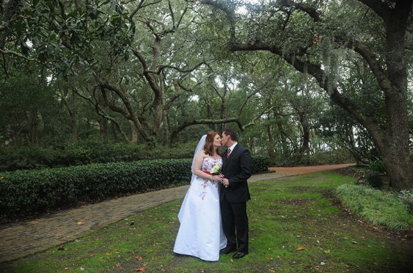 Bride and Groom Kissing Outside