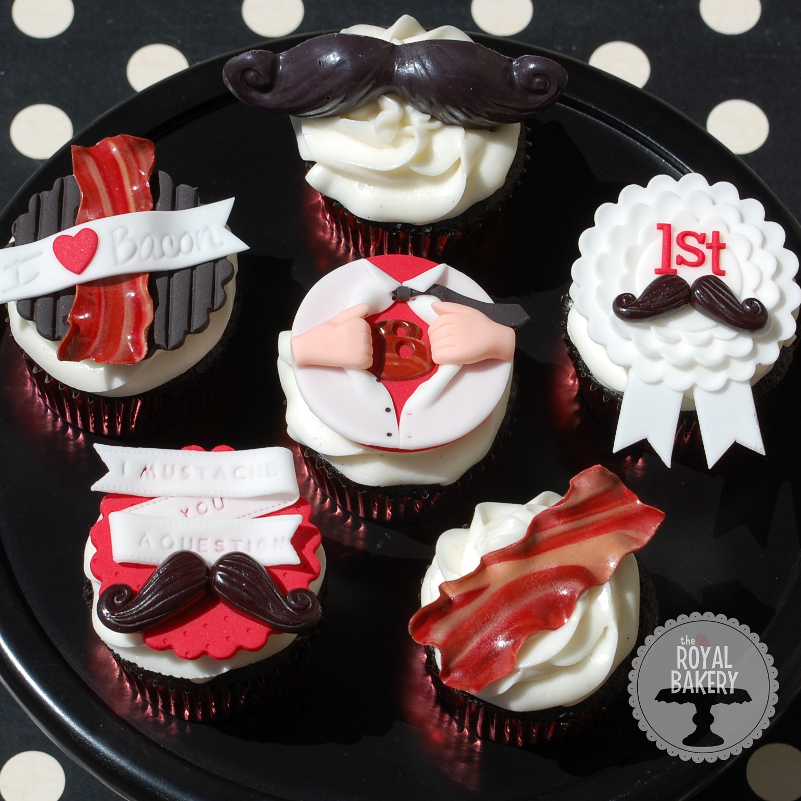 Series of Cupcakes with Red, Black, and White Shiny Tops