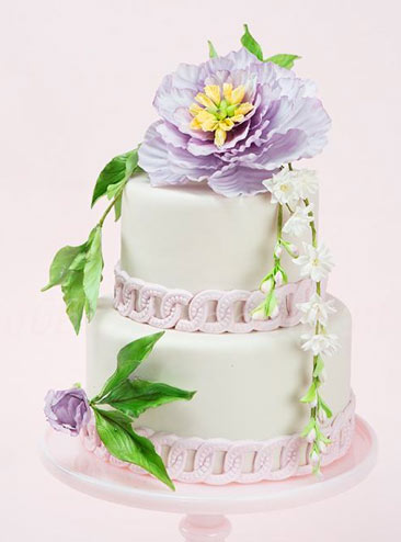 Tiered Cake Topped with Flower and Vines