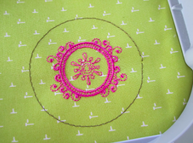 Pink Embroidery Design on Green Fabric