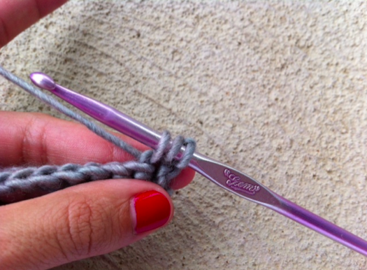 Woman's Hands Displaying Yarn Loops on Crochet Hook