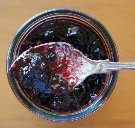 Jar of Homemade Jam with a Silver Spoon