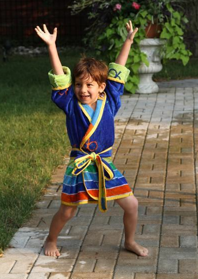 Little Boy Acting Silly in Bright Blue Robe