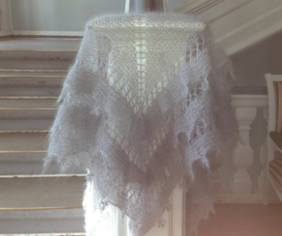 White Loose Knit Shawl Overhanding Stairway Banister