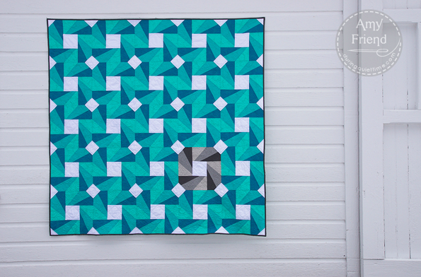 Green, Blue and White Quilt with Spinning Wheel Design