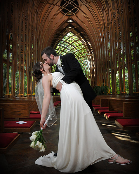 Bride and Groom Kissing in Beautiful Church