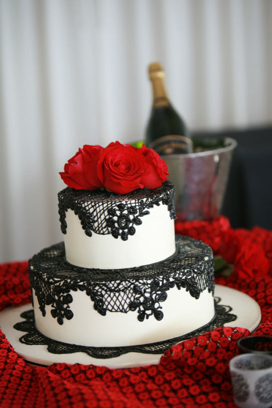 White Cake with Black Lace and Red Flower Toppers