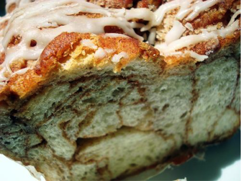 Cross Section of Bread Pudding with Cinnamon Veins, Drizzled in Icing 