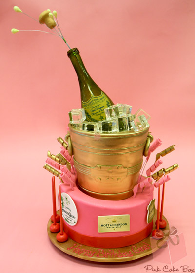 Cake in Shape of Champagne Bottle in Bucket with Ice