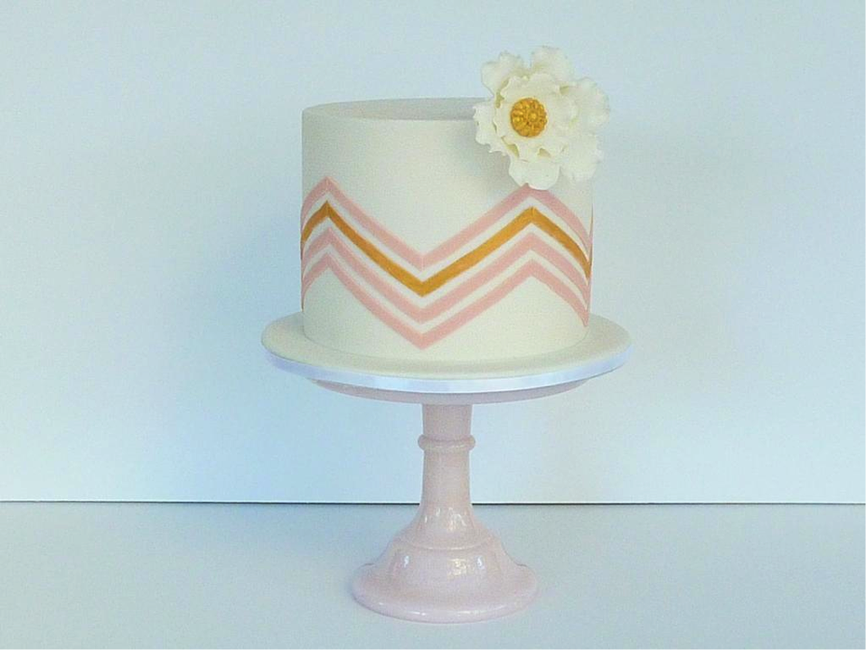 White Cake with Pink and Orange Chevron Stripes and Flower