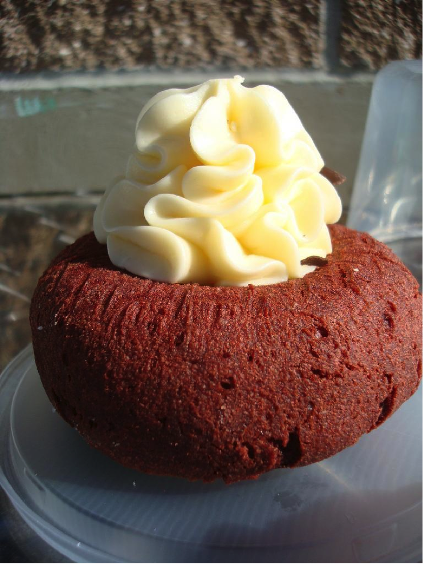 Large Red Doughnut Topped with a Dollup of Icing