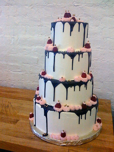 Three-Tiered Wedding Cake with Chocolate Dripping Down Sides