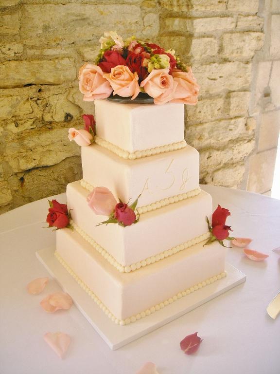 Four-Tier Peach Wedding Cake with Roses on Top