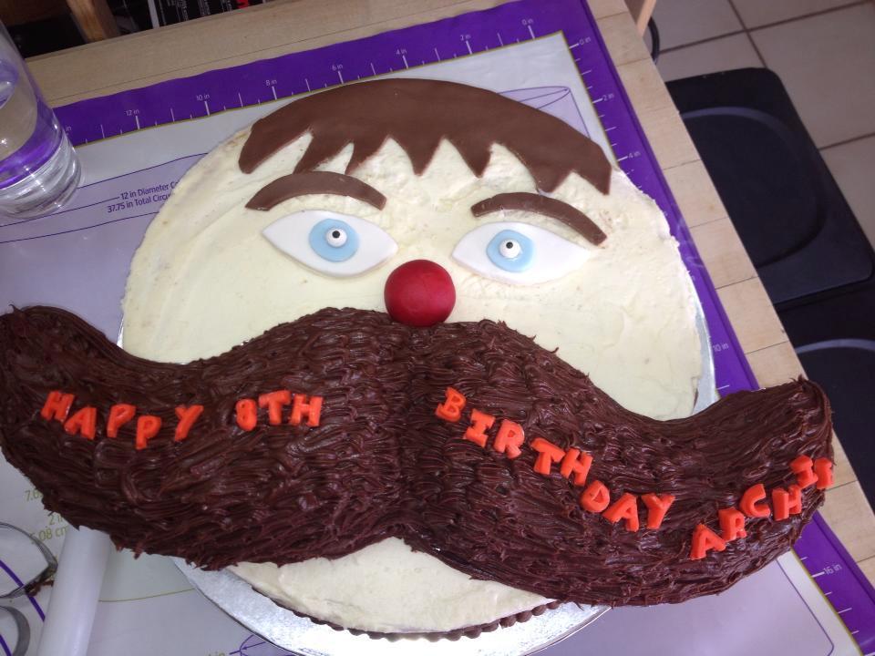 Birthday Cake in Shape of Face with Large Mustache