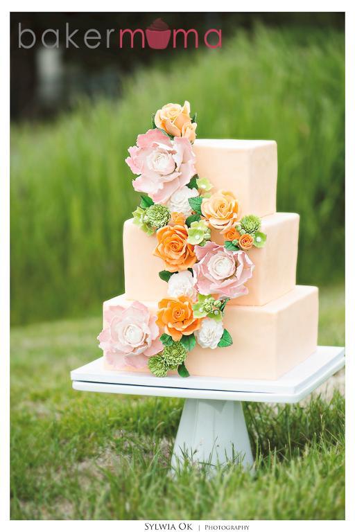 Peach Three-Tier Wedding Cake with Floral Strand Decoration