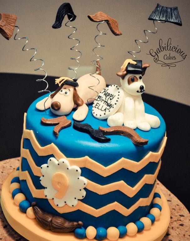 Blue Cake Topped with Dogs and Mustaches on Springs