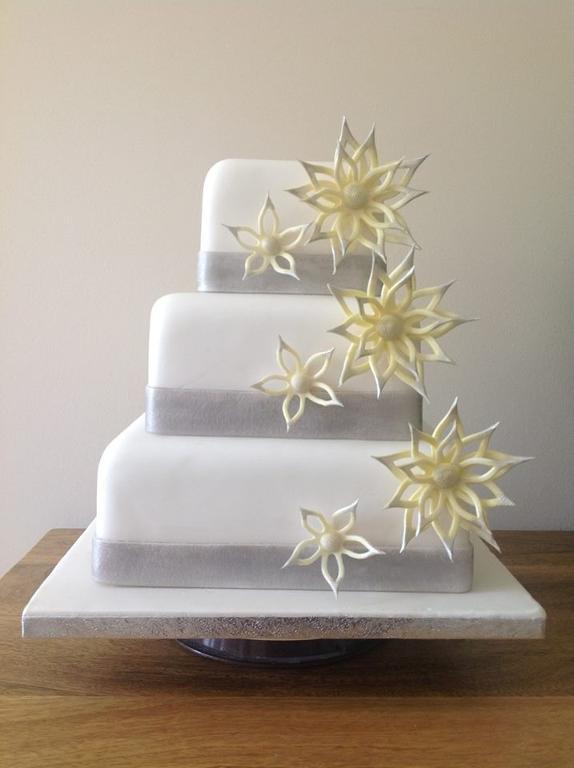 Three-Tier White and Silver Wedding Cake with Stars