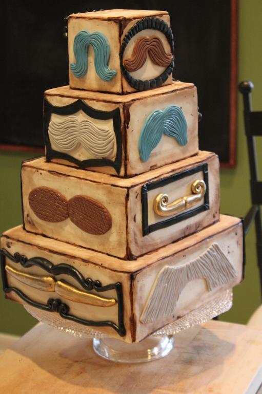 Tiered Cake Featuring Different Varieties of Fondant Mustaches