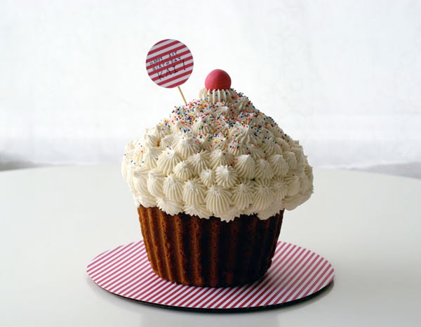 Cake in Shape of Giant Cupcake with Cherry on Top