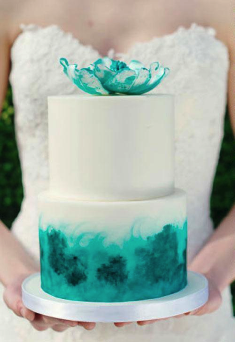 Woman Holding Tiered Green Cake 