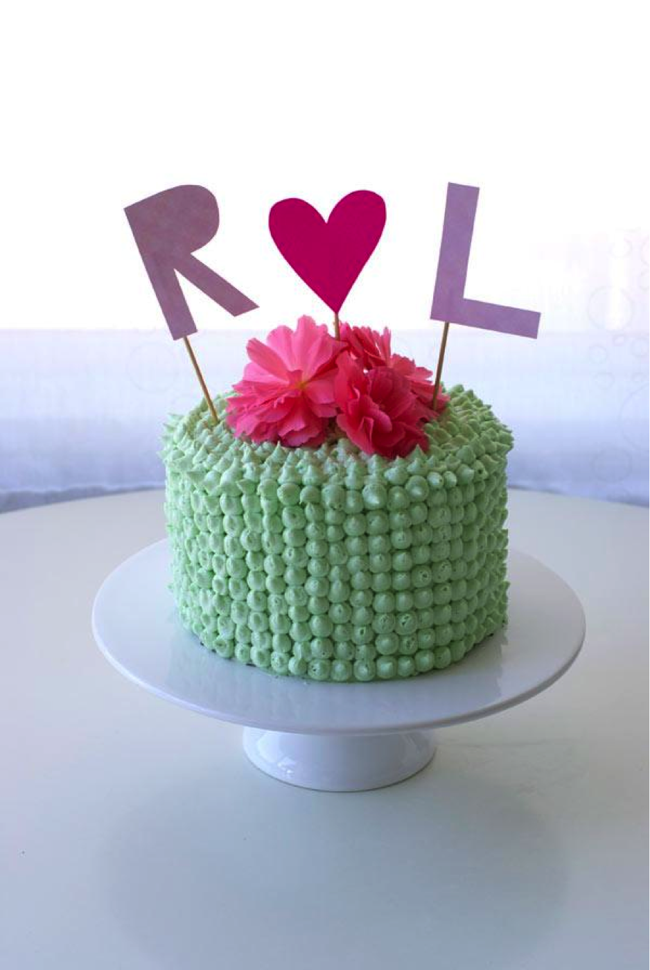 Mint Buttercream Cake Topped with Pink Flowers