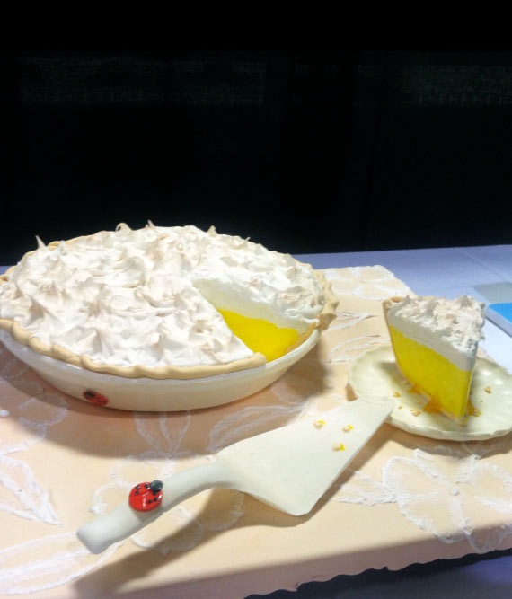 Cake in Shape of Lemon Meringue Pie with Slice Cut Out