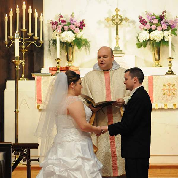 Bride and Groom at Altar with Priest