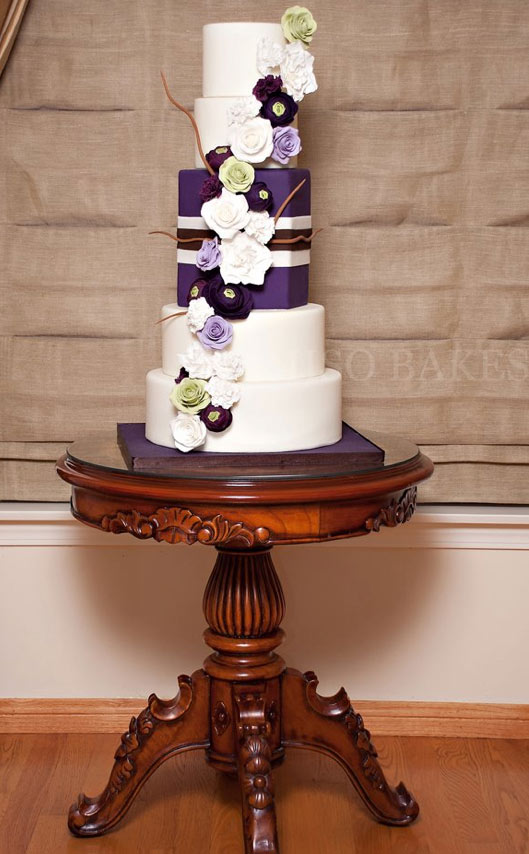 5-Tier White Wedding Cake with Purple Flowers and Present Insert