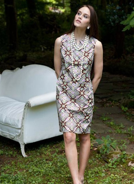 Woman Wearing Pearls and Patterned Dress