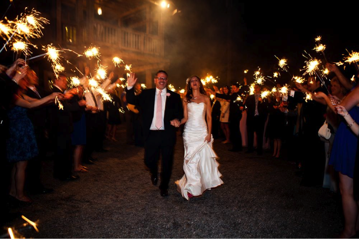 Wedding Couple Walking Through Crowd with Sprinklers