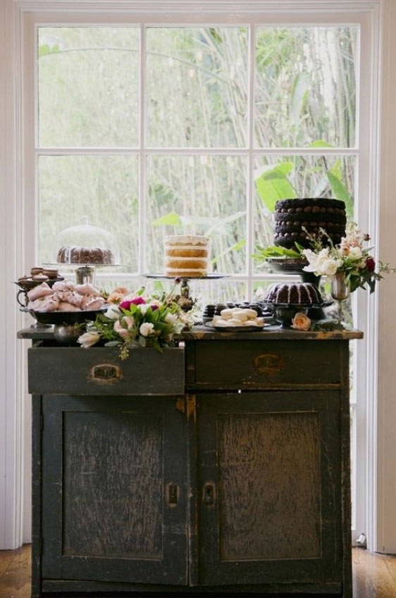 Rustic Table Featuring an Array of Desserts and Decorations