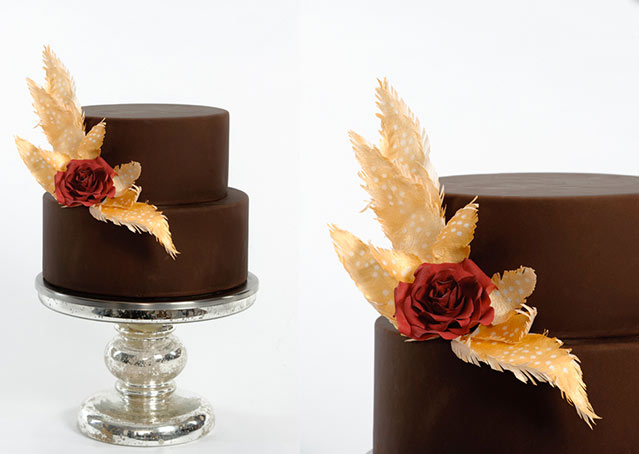 Two-Tiered Chocolate Wedding Cake with Gold Leaves and Red Bow