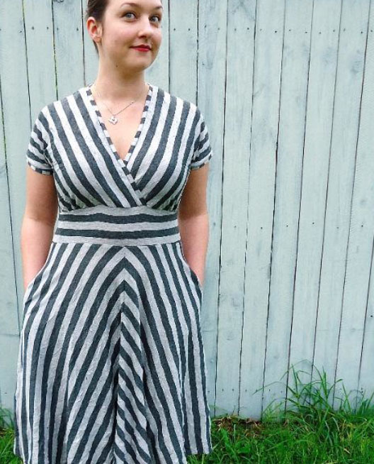 Woman Wearing Striped Dress and Smiling