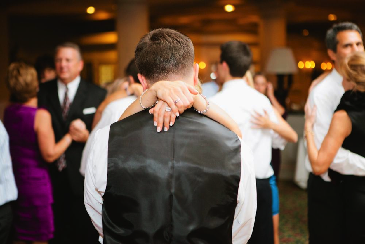 Bride with Arms Around Groom on Dancefloor