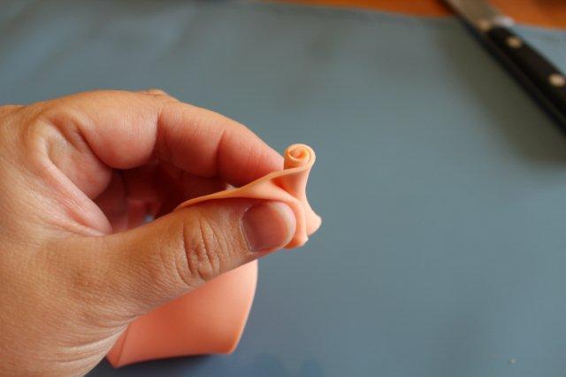 Hand Beginning to Ruffle Fondant Rose