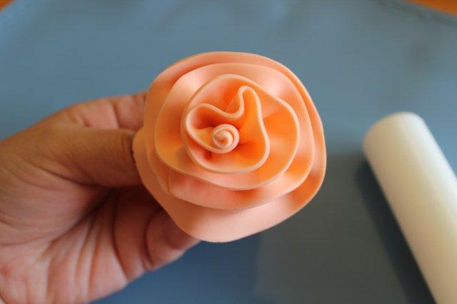 Hand Displaying Finished Fondant Rose