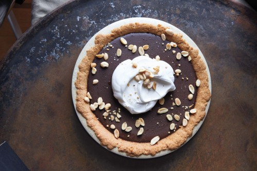 View of Pudding Pie with Whipped Cream and Nuts