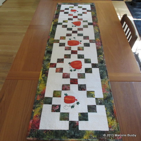 Pumpkin Table Runner Laying on Long Table