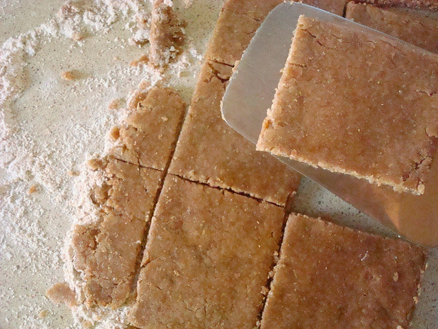 Dough on Floured Surface Being Cut and Divided